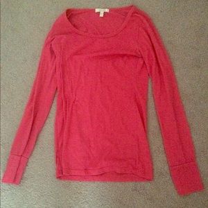 Pink Delia’s shirt.